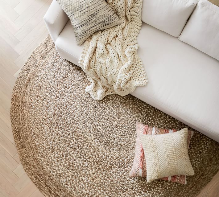 Wool sisal rugs in a round shape with beautiful sofa in white color