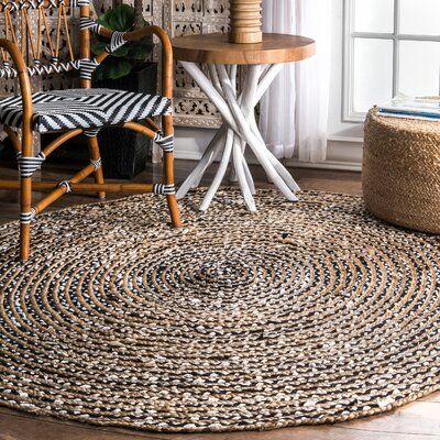 Outdoor Sisal round rugs with beautiful chair and stool in a space 