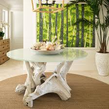 seagrass rugs in round shape placed on a marble floor with beautiful table on it.